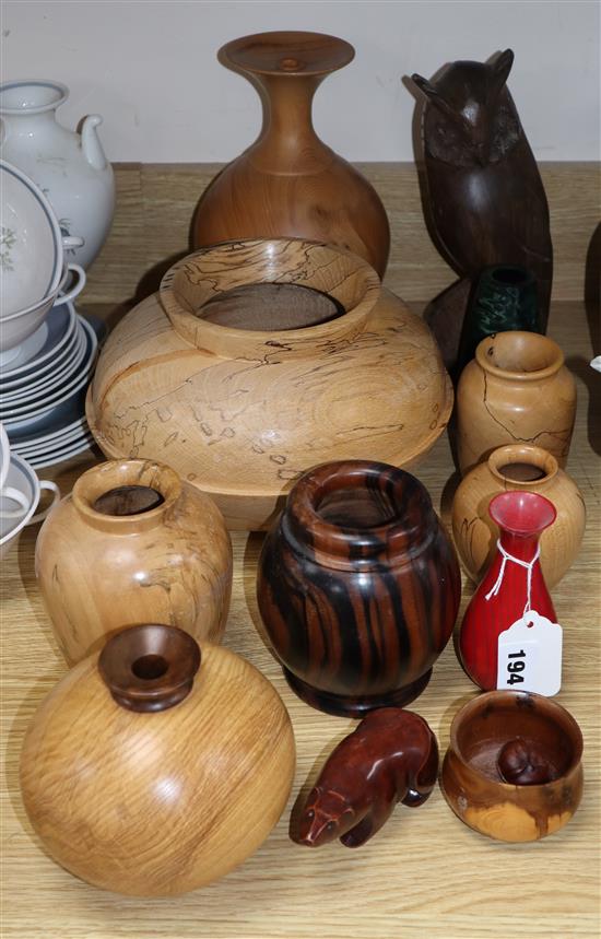 A collection of turned wood vases, carvings, some signed (12) Tallest 26cm